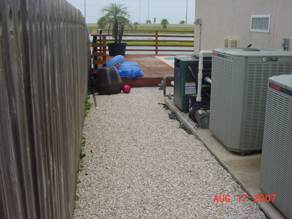 EXISTING GRAVEL GROUND COVER at SIDE of HOUSE